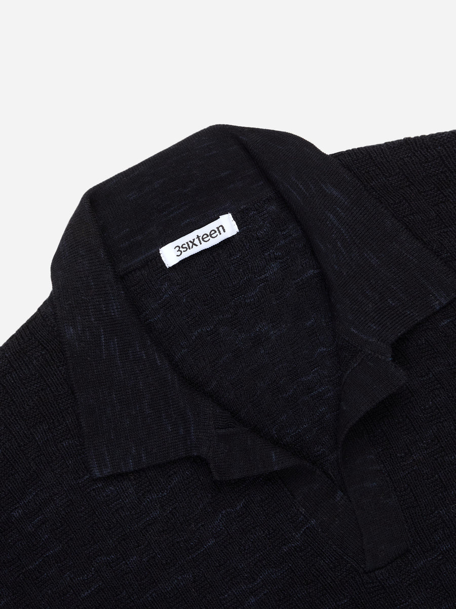Black textured fabric with a '3sixteen' label on a white background