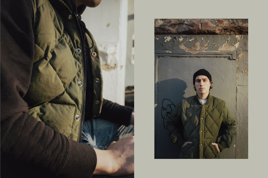 A diptych of a closeup shot of the olive vest and a portrait of the model wearing a black watch cap and the olive down jacket.